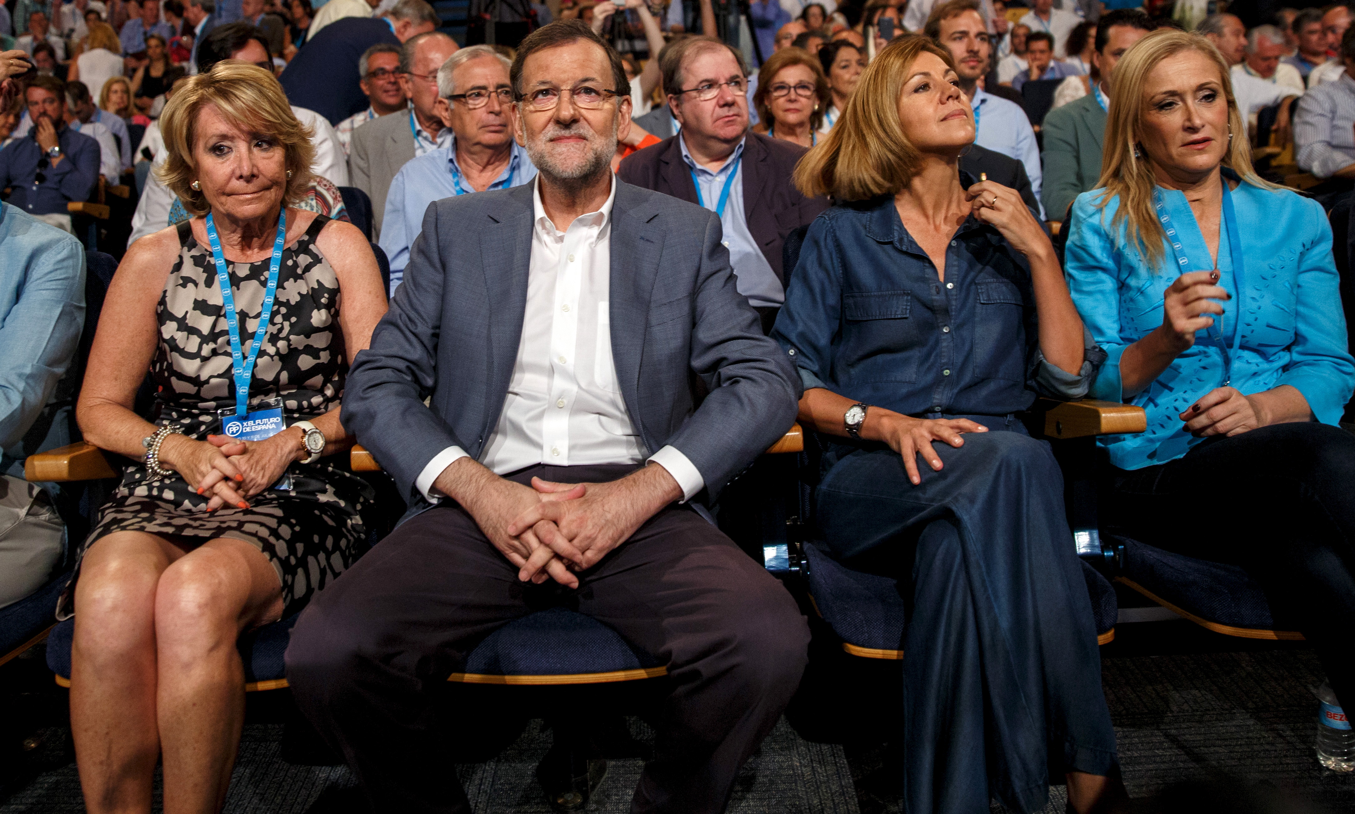 L-R: Madrid town hall councillor Esperanza Aguirre, Prime Minister Mariano Rajoy, People's Party (PP) party secretary, Maria Dolores de Cospedal and Madrid regional president Cristina Cifuentes attend a party rally in Madrid, Spain, July 11, 2015. Spain said on Friday it would cut central government spending further in 2016, offsetting broad-based tax cuts unveiled last week as it looks to keep a healthy economic recovery on track ahead of national elections. REUTERS/Andrea Comas - RTX1JZCM
