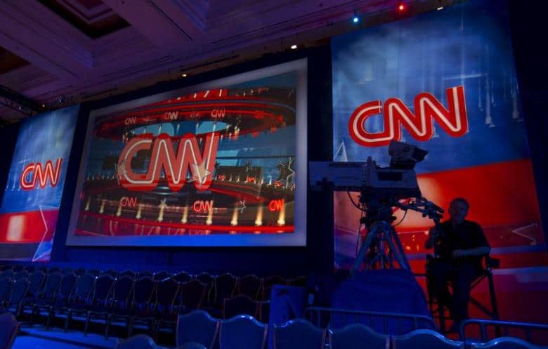 A CNN camera operator waits by his camera as the network prepares  for the first democratic presidential candidate debate at the Wynn Hotel in Las Vegas, Nevada October 13, 2015.   REUTERS/Mike Blake