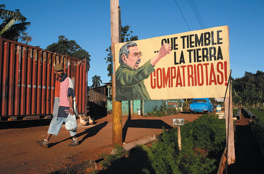A sign showing Cuban President Raúl Castro, and saying ‘May the earth tremble, compatriots!,’ Havana, Cuba, December 2014