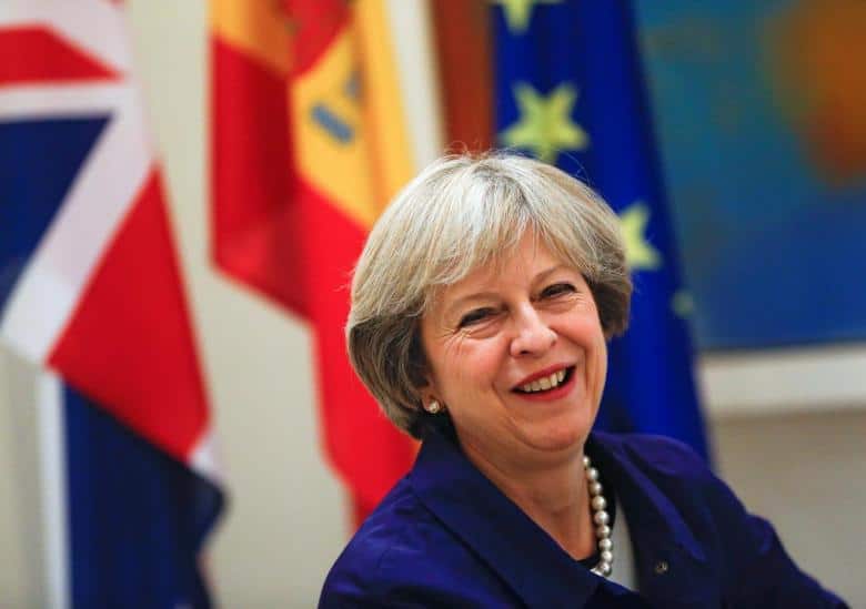 British Prime Minister Theresa May smiles during a meeting with Spain's acting Prime Minister Mariano Rajoy at the Moncloa Palace in Madrid, Spain, October 13, 2016.   REUTERS/Juan Medina