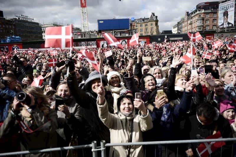 People wave Danish flags as they celebrate the 75th birthday of Denmark's Queen Margrethe, who is received at the City Hall, April 16, 2015. REUTERS/Mathias Bojesen/Scanpix Denmark