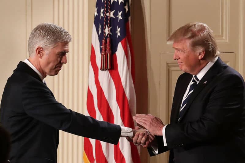 WASHINGTON, DC - JANUARY 31:  U.S. President Donald Trump (R) shakes hands with Judge Neil Gorsuch after nominating him to the Supreme Court during a ceremony in the East Room of the White House January 31, 2017 in Washington, DC. If confirmed, Gorsuch would fill the seat left vacant with the death of Associate Justice Antonin Scalia in February 2016.   (Photo by Chip Somodevilla/Getty Images)