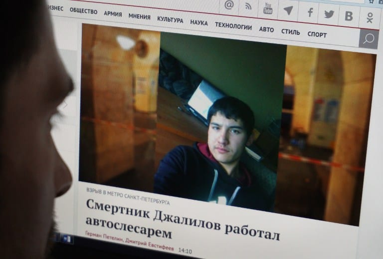 A man looks at a computer screen displaying a news report with a photograph of suspect in the April 3 blast Akbarjon Djalilov on April 4, 2017 in Moscow.      
Russia's Investigative Committee on April 4 named the attacker behind Saint Petersburg metro blast as Akbarjon Djalilov, adding that he had also planted a second bomb that was defused by the authorities. / AFP PHOTO / -