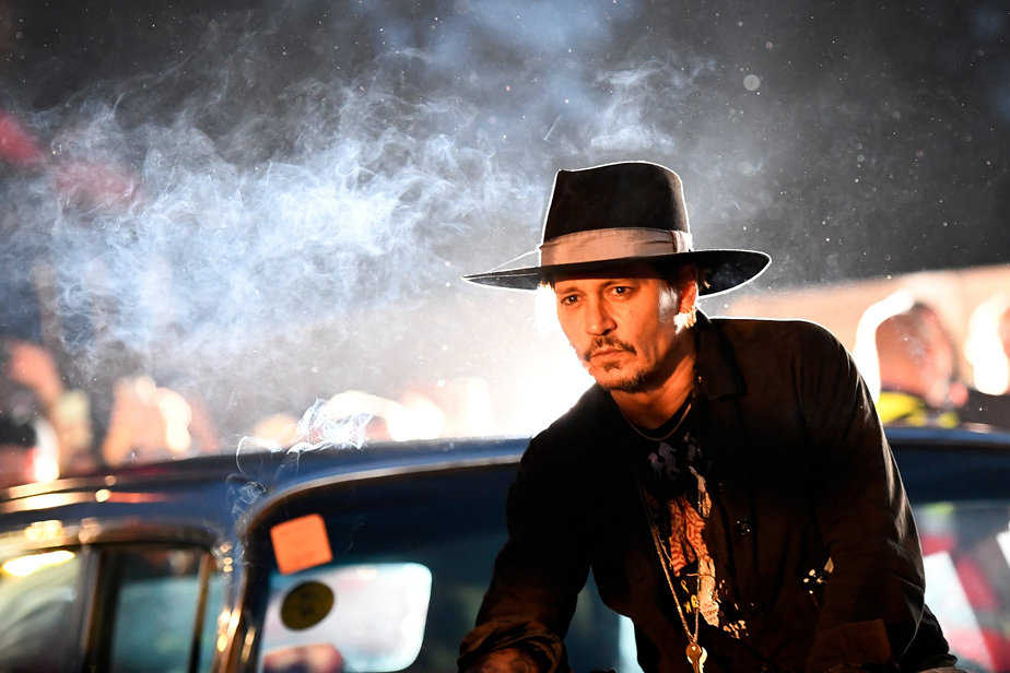 Actor Johnny Depp poses on a Cadillac before presenting his film The Libertine, at Cinemageddon at Worthy Farm in Somerset during the Glastonbury Festival in Britain, June 22, 2017.  REUTERS/Dylan Martinez