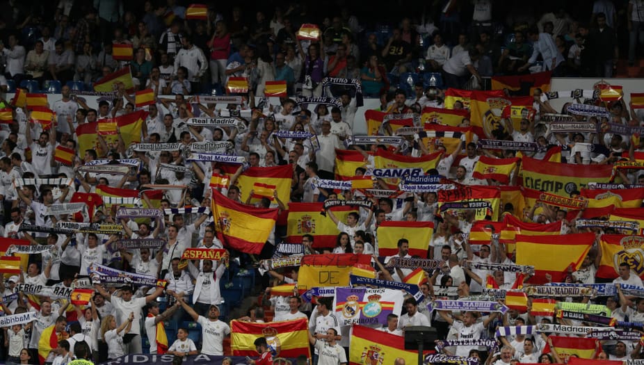 Soccer Football - La Liga Santander - Real Madrid vs Espanyol - Santiago Bernabeu, Madrid, Spain - October 1, 2017   Real Madrid fans with Spanish flags   REUTERS/Rafael Marchante - RC1F1A94C480