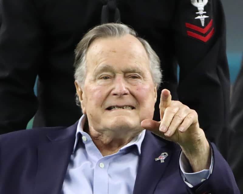 FILE PHOTO: Former U.S. President George H.W. Bush arrives on the field to do the coin toss ahead of the start of Super Bowl LI between the New England Patriots and the Atlanta Falcons in Houston, Texas, U.S., February 5, 2017. REUTERS/Adrees Latif
